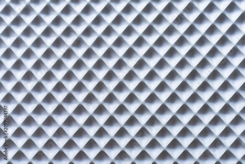 The texture features a repeating pattern of diamond shapes with raised edges.