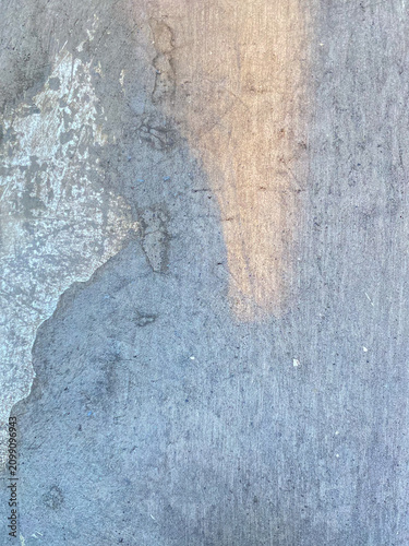 Close up of weathered gray concrete surface texture with natural stains and rough cement background, abstract industrial wall pattern suitable for design overlays and graphic resources.