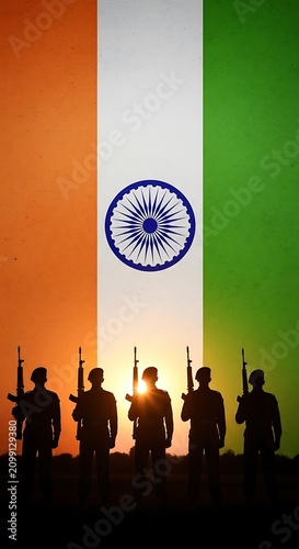 Silhouetted Soldiers Standing Against Indian Flag Background.