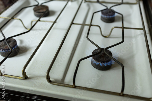 фотографія Gas stove with blue flame, the concept of energy crisis and lack of heating and