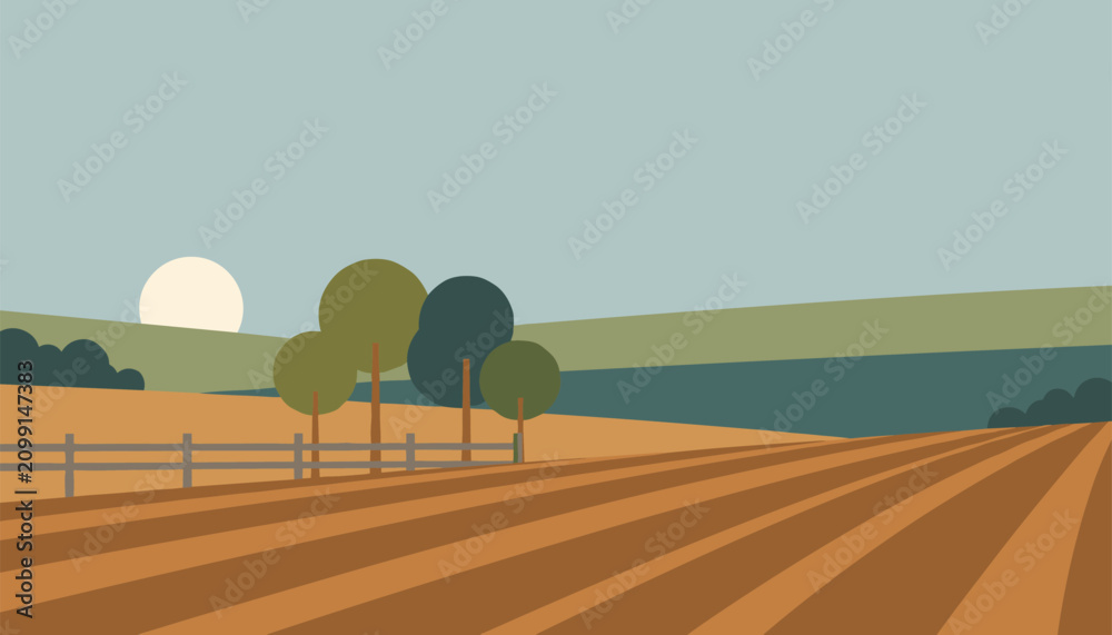 Fototapeta premium Ploughed agricultural field with neat soil rows, green trees, a fence, and a rising sun in the background.