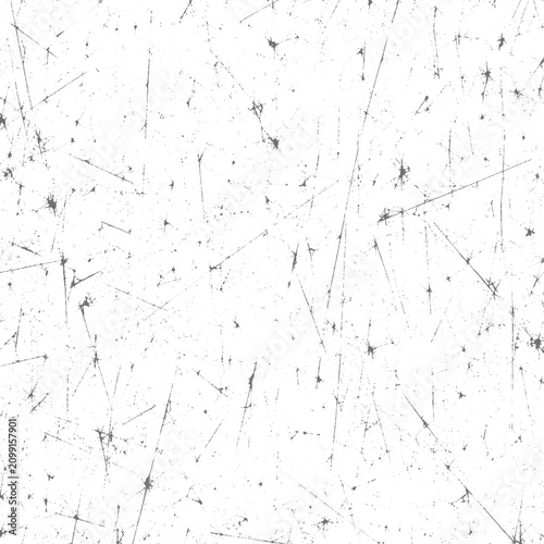 Grunge texture pattern with scattered black marks on white background