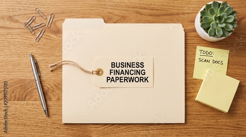 Business financing paperwork folder on wooden desk, corporate financial documents with tag, professional office organization for loan applications