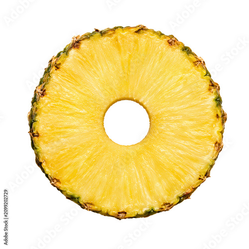 A single slice of fresh pineapple with a hollow center is isolated against a white.
