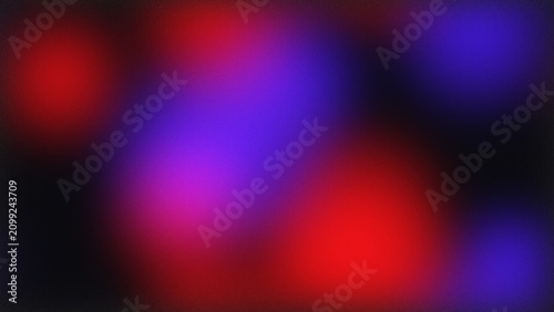 Abstract background with soft glowing red and blue light circles and dark texture