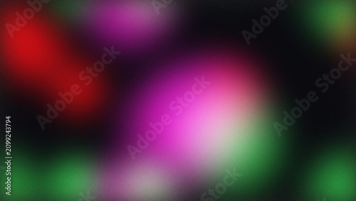 Abstract blurred background with soft glowing red purple and green light spots