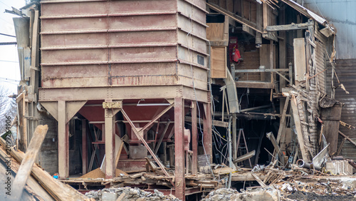 Obraz na plátne A large structure stands partially collapsed at a construction site