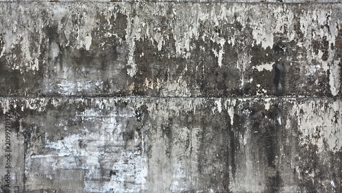 Photos Weathered white exterior wall turned grayish from dirt and age, featuring a roug