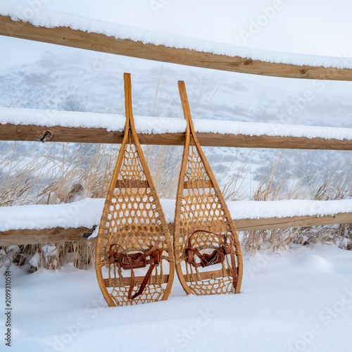 classic wooden Huron snowshoes in winter scenery at foothills of Rocky Mountains in northern Colorado - Lory State Park