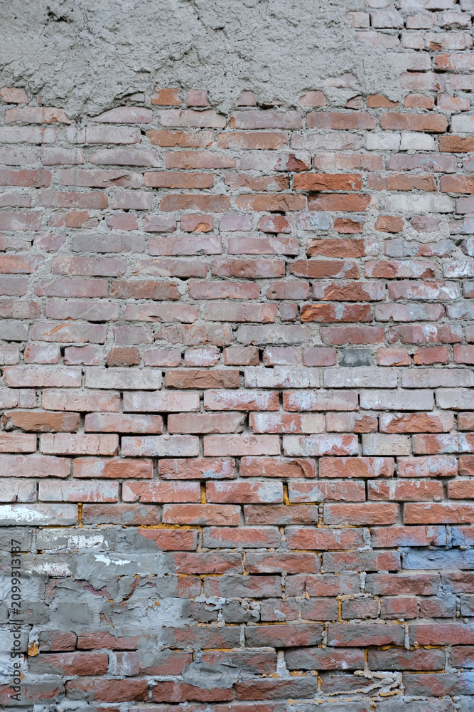 Fototapeta premium Wall of old, weathered red brick – abstract grunge background