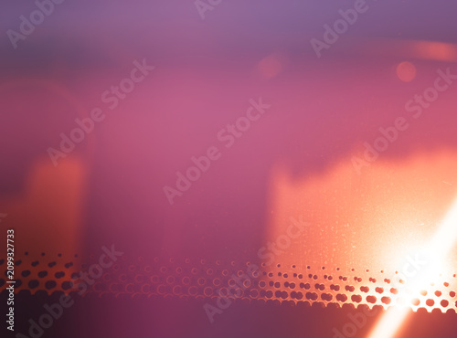 Dramatic light leak on the bus glass abstract backdrop