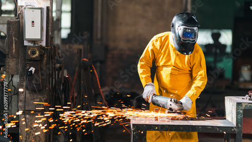 Canvas Print Metal worker grinder spark welding factory protective helmet glove industry, met