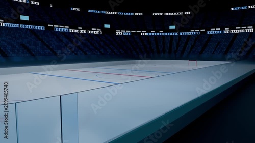 Pulling back camera panning along dasher boards and glass at hockey arena, revealing rink markings