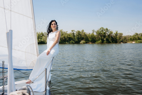 young couple guy and girl on a sailing yacht