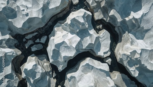 Icebergs Float in Dark Water During Daytime in a Remote Arctic Area
