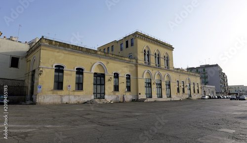 Принти на полотні Bisceglie railway station facade and parking lot in puglia