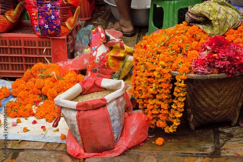 Traditional flower market with marigolds and rice near Patan Durbar Square, Nepal