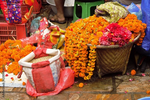 Colorful marigold flowers and rice for sale at a traditional market near Patan, Kathmandu Valley, Nepal