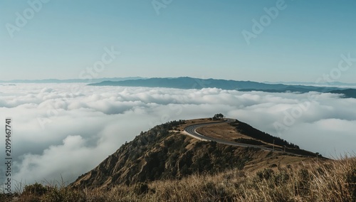 Fog Covers the Valley as the Road Curves Through the Mountains in the Morning...