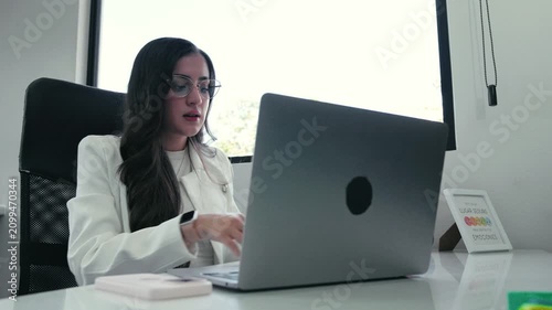 Professional businesswoman attending online video call meeting