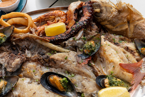 Delicious seafood platter with local fish and shellfish served in a restaurant in Caleta de Sebo, La Graciosa, Canary Islands, Spain