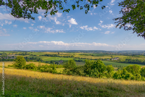 Canvas Print Summer landscape, The terrain of hilly countryside, A hamlet on hillside with gr