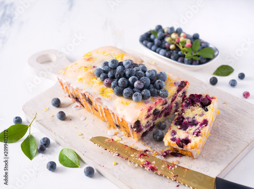 Homemade blueberry lemon loaf cake with fresh homegrown blueberries; copy space