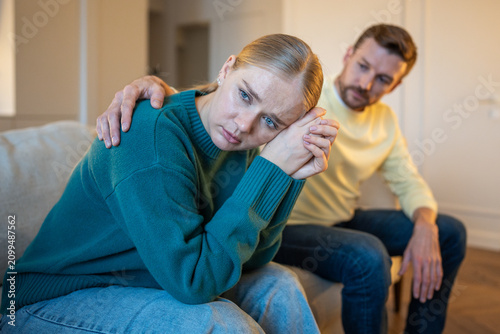 Принти на полотні Married couple in toxic relationships, guilty man partner trying to make peace with distressed wife, offended woman turned away from husband showing coldness and offence, manipulative emotions
