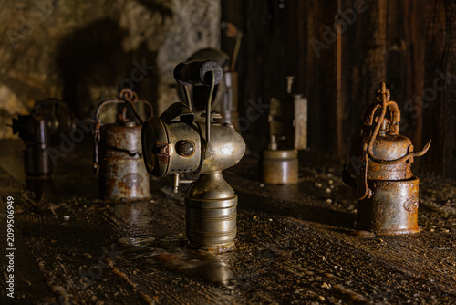 Bild auf Leinwand A historical museum display of antique miner carbide lamps (acetylene lamps) ins