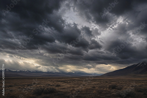 Dark Storm Clouds over a Barren Mountain Landscape