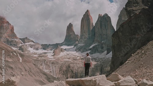Female hiker standing at Mirador Las Torres in Torres del Paine National Park, Patagonia, Chile