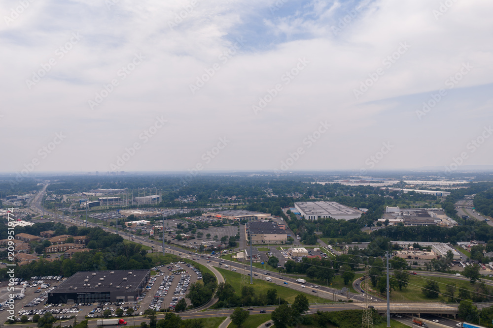Fototapeta premium Aerial view showing urban sprawl and industrial park