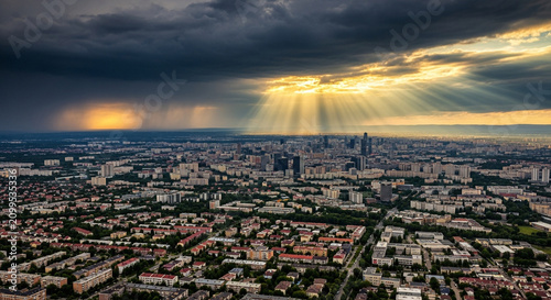 Cityscape with sun rays through clouds