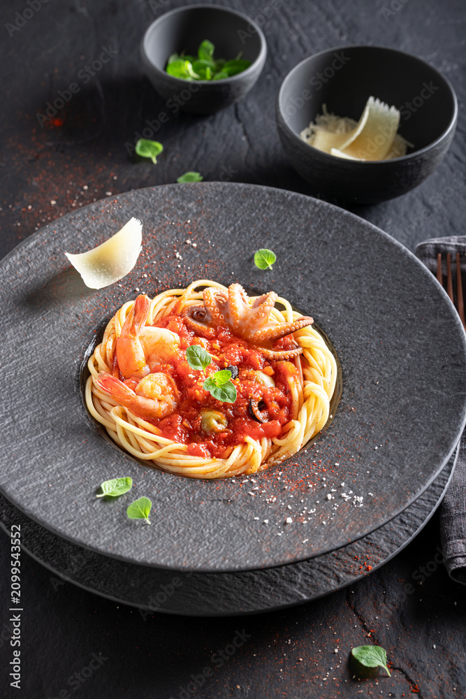 Fototapeta premium Professional and fresh spaghetti bolognese with octopus and shrimps.