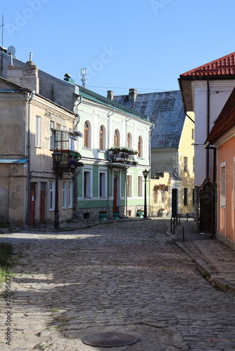 Quiet cobblestone street with colorful historic buildings in old town