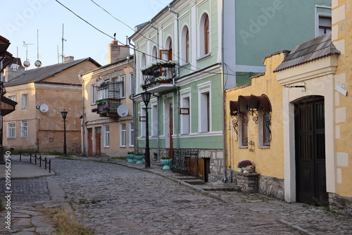 Charming historic cobblestone street with colorful traditional buildings