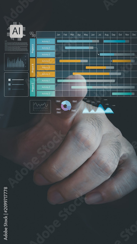 A hand touches a virtual holographic interface displaying a Gantt chart, data graphs, and an AI microchip icon, illustrating smart digital project management.