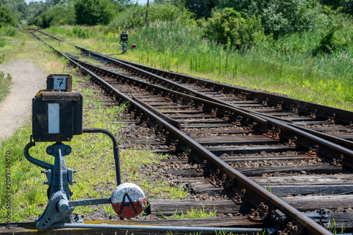 Foto Close Up of Railway Switch and Train Tracks