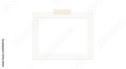 A blank white Polaroid photo frame with a beige sticky tab picture instant camera photography