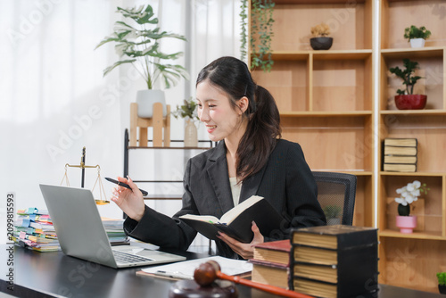 Judge gavel with Justice lawyers, Businesswoman in suit or lawyer working on a documents in courtroom. Legal law, advice and justice concept