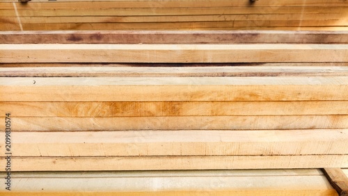 Wood or wood texture 2 inches by two inches and 1 inch by two inches. Wood stack Stacked together Nature cut into pieces for decorating work or Structure. wood material industrial background