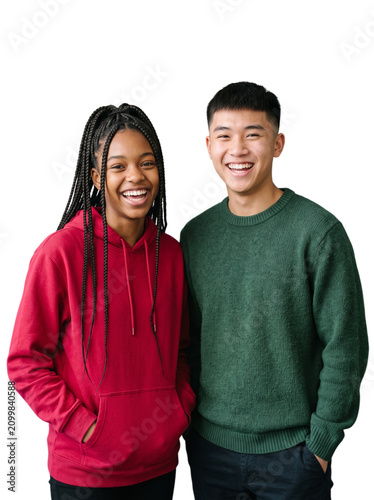 Cheerful diverse teenage friends laughing in hoodies