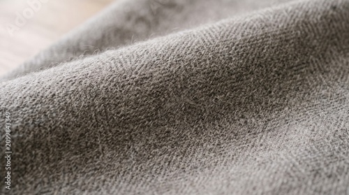 Gray woven wool fabric texture. Soft textile material background for interior design.