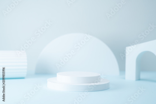 Minimalist Product Display Podium with Geometric Shapes on Light Blue Background