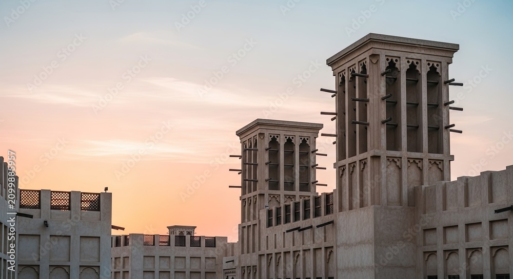 Fototapeta premium Traditional Wind Towers at Sunset in Dubai Heritage District