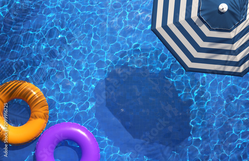 Beautiful swimming pool with beach umbrella. Pool party, summer background.  