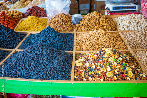 фотографія Traditional market display featuring premium raisins, dried apricots, walnuts, a