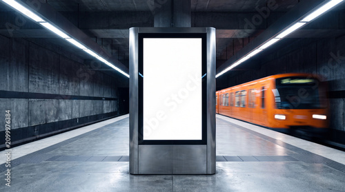 Blank vertical billboard mockup in subway station with blurred orange train speeding by