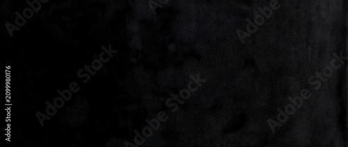 Foto Black textured wall reveals a deep matte painted surface with subtle brushstroke