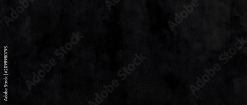 Fotografie Black texture background sinking into near total darkness with faint grainy shad